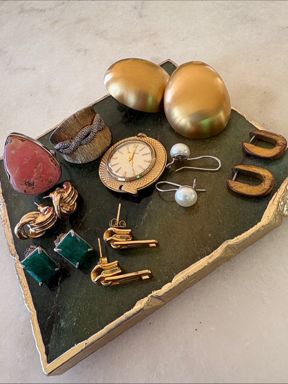 Jewelry Lot. 6 earrings, 2 rings, 1 bulova watch pendant. Mostly gold toned.